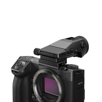 Professional cinema camera body with mounted external recorder on top, showing open sensor cavity.