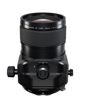 Perspective view of a tilt-shift lens mounted on a camera body with focus adjustment knob visible.