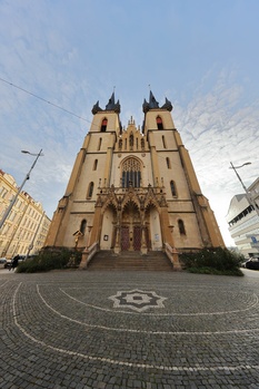 Gothic cathedral with twin spires photographed from street level with symmetrical composition.