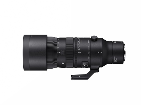 Black telephoto lens with tripod collar and focusing ring against white background.