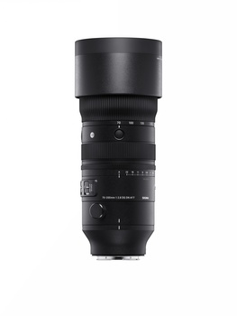 Black telephoto lens with focus ring and distance scale markings against white background.