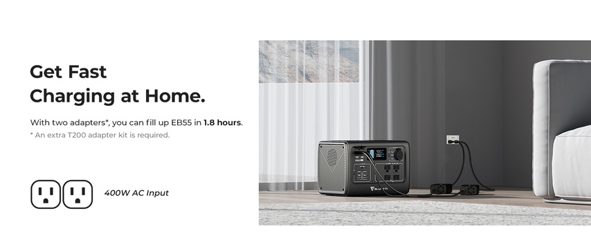 Portable power station with dual AC outlet adapters and charging cable in a bedroom setting.