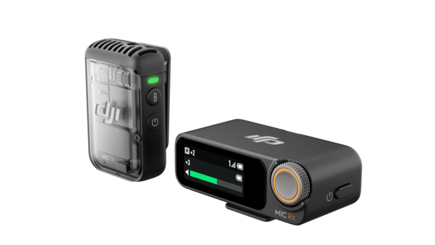 Two wireless audio transmitter units displayed against a white background.