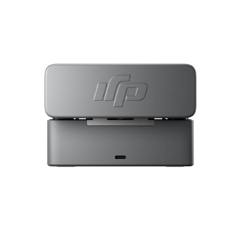 HP docking station with gray aluminum casing and embossed logo, shown open from top view.