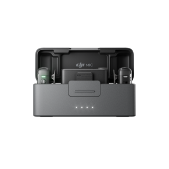 DJI Mic wireless microphone system in gray charging case with two transmitter units and receiver visible.