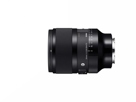 Black telephoto zoom lens with focus ring and distance scale markings against white background.