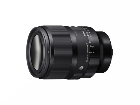 Black telephoto lens with manual focus ring and depth-of-field scale markings.