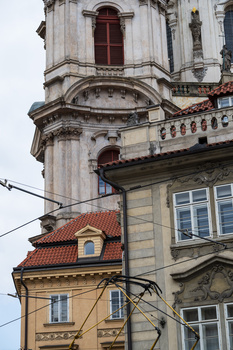 Historic European buildings with ornate architectural details and terracotta roofing.