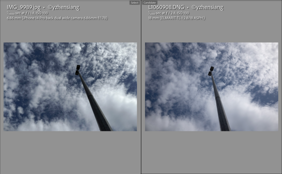 Telephoto lens pointed upward toward dramatic cloudy sky with white cumulus formations.