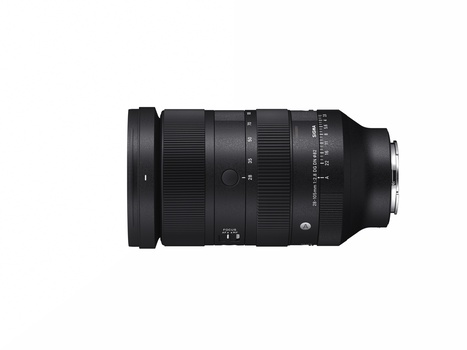 Black telephoto zoom lens with focus ring and distance scale markings displayed against white background.