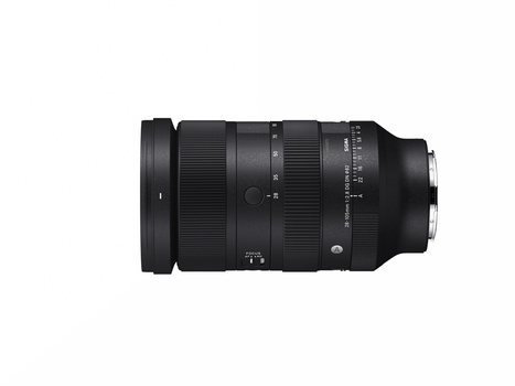 Black telephoto zoom lens with ribbed focus ring and control markings displayed against white background.