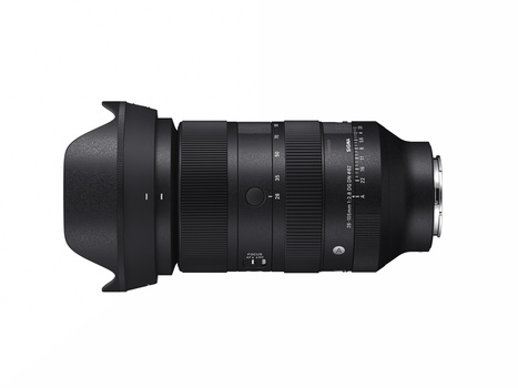 Black telephoto zoom lens with hood and focus ring against white background.