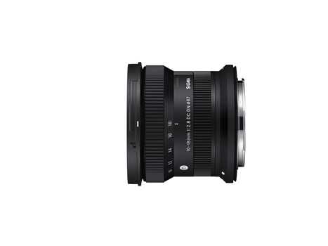 Black ultra-wide angle zoom lens with focus and zoom rings displayed against a white background.