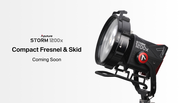 Aputure Storm 1200x compact Fresnel light mounted on a stand with red control dial visible.
