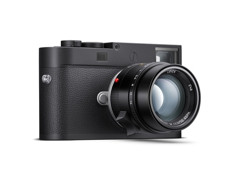 Rangefinder camera with textured black leather body and attached prime lens.