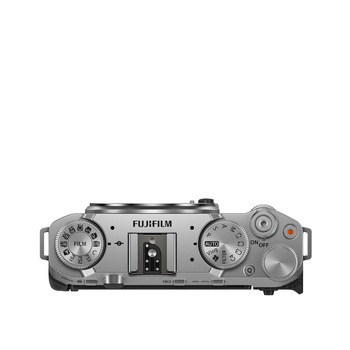 Top-down view of a silver Fujifilm rangefinder camera showing dual dials, viewfinder, and central controls.