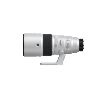 Silver telephoto lens with black grip ring and white control markings mounted on gray support foot.