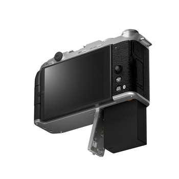 Digital camera with articulating monitor displayed against white background.