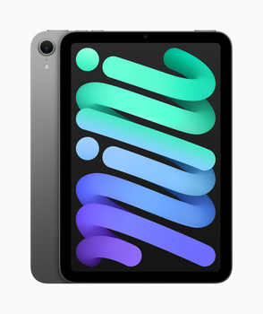 iPad Mini with space gray finish displaying colorful gradient design on screen.