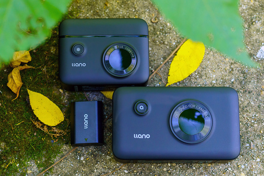 Two Uiano compact cameras displayed on a moss-covered surface with yellow leaves.