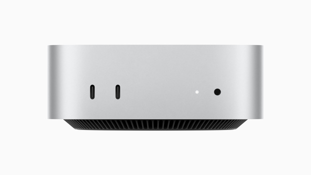 Top view of a compact silver desktop computer with two USB-C ports and indicator lights.
