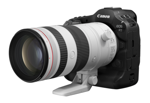 Canon EOS R5 mirrorless camera with white telephoto lens attached.