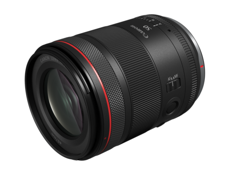 Canon RF-mount telephoto zoom lens with red accent ring and textured grip bands.