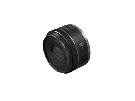 Black compact camera lens with focus and aperture rings against a white background.