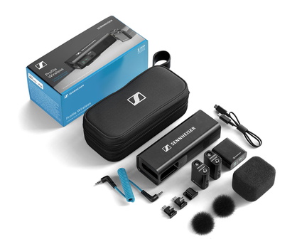 Sennheiser wireless microphone kit with carrying case and accessories laid out.