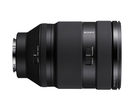 Sony zoom lens with extended barrel and textured grip surfaces shown in profile.