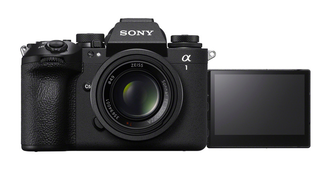 Sony α1 mirrorless camera with articulating screen extended, featuring Zeiss lens and textured grip.