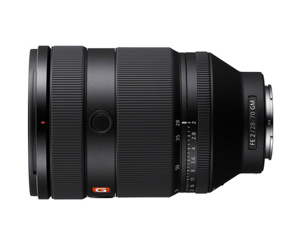 Wide-angle zoom lens with extending barrel and focus ring, shown in profile against white background.