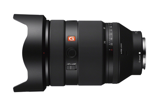 Sony G-series zoom lens with hood attached, shown in profile against white background.