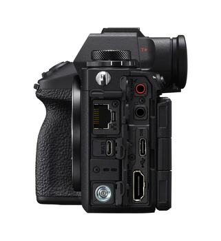 Side view of a mirrorless camera body showing ports, controls, and textured grip.
