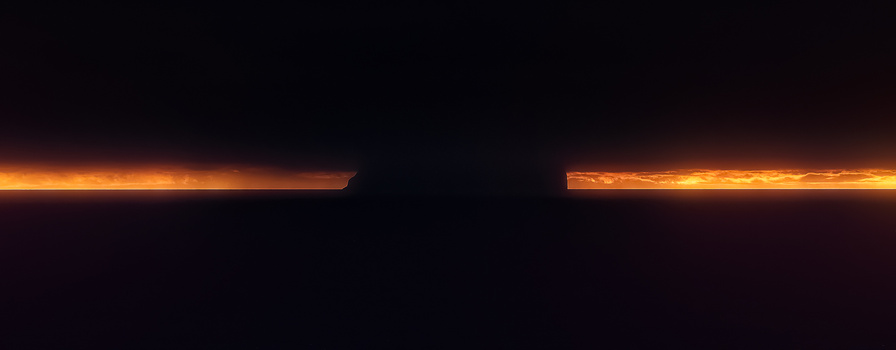Silhouetted landscape with golden sunrise or sunset light breaking across the horizon.