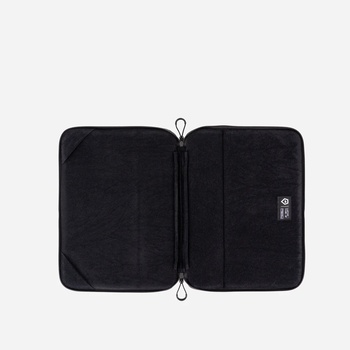 Black protective carrying case with dual compartments opened flat, displaying interior storage layout.