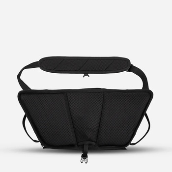 Illustration of a black camera bag with multiple compartments and shoulder straps.