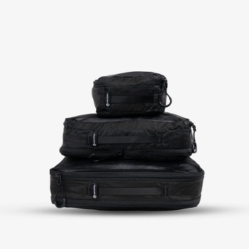 Three black hard-shell luggage cases stacked in descending size order against a white background.