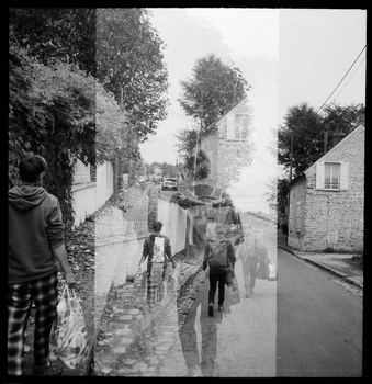 Multiple exposure or composite image showing ghosted figures walking down a residential street lined with trees.