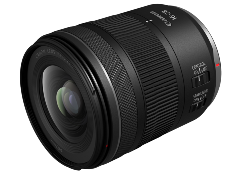 Black telephoto zoom lens with ribbed barrel and control rings against white background.