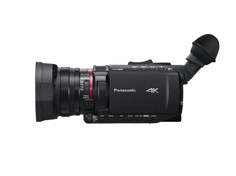 Panasonic 4K camcorder with attached lens and articulating viewfinder, shown in profile against white background.