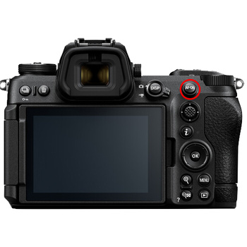 Mirrorless camera body shown from rear with LCD screen displayed and grip-mounted control buttons visible.