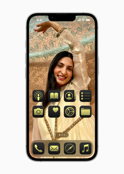 Screenshot of a smartphone home screen customization interface with a portrait photo and golden app icons.