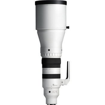 White and black telephoto lens with extending barrel and focus ring against white background.