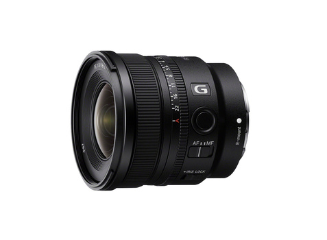 Sony G-series wide-angle lens with black barrel and focus ring against white background.