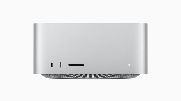 Silver desktop computer with minimalist design and ventilation grille, front view against neutral background.