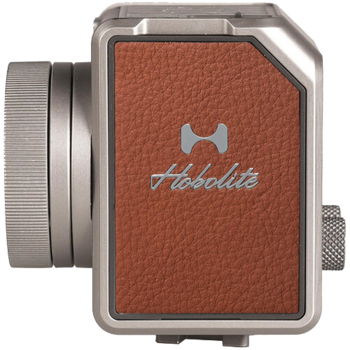 Holodite instant film camera with rust-colored leather body panel and metal frame.