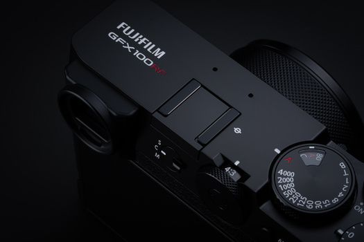 Fujifilm GFX100 medium format camera shown from above with manual focus ring visible on right side.