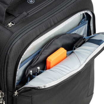 Black backpack with open compartment displaying organized gear including an orange item, blue pouch, and white padded dividers.