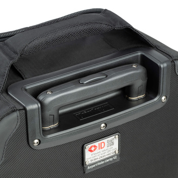 Interior view of a camera roller bag showing the padded compartment and metal handle recess.